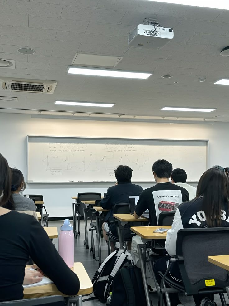 International students studying together at a table in a university library