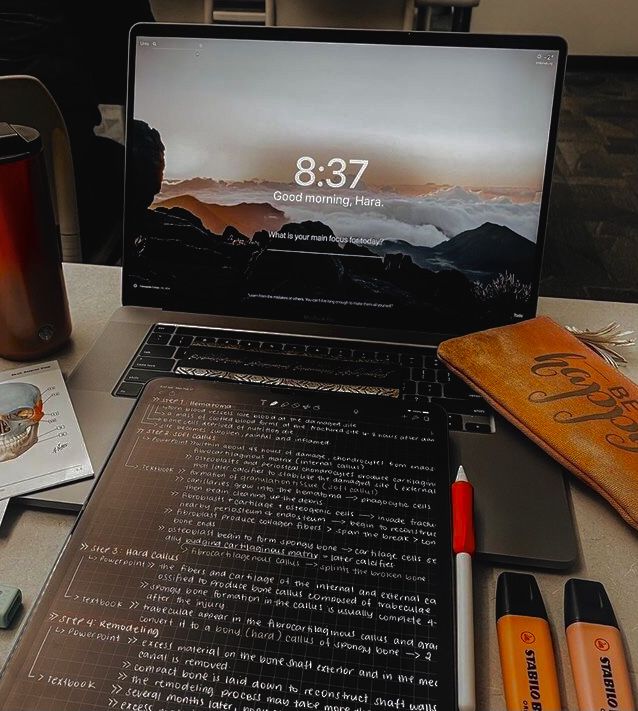 A stack of documents and papers organized on a desk